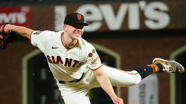  San Francisco Giants starting pitcher Kyle Harrison (45) pitches the ball against the Cincinnati Reds during the seventh inning at Oracle Park. 